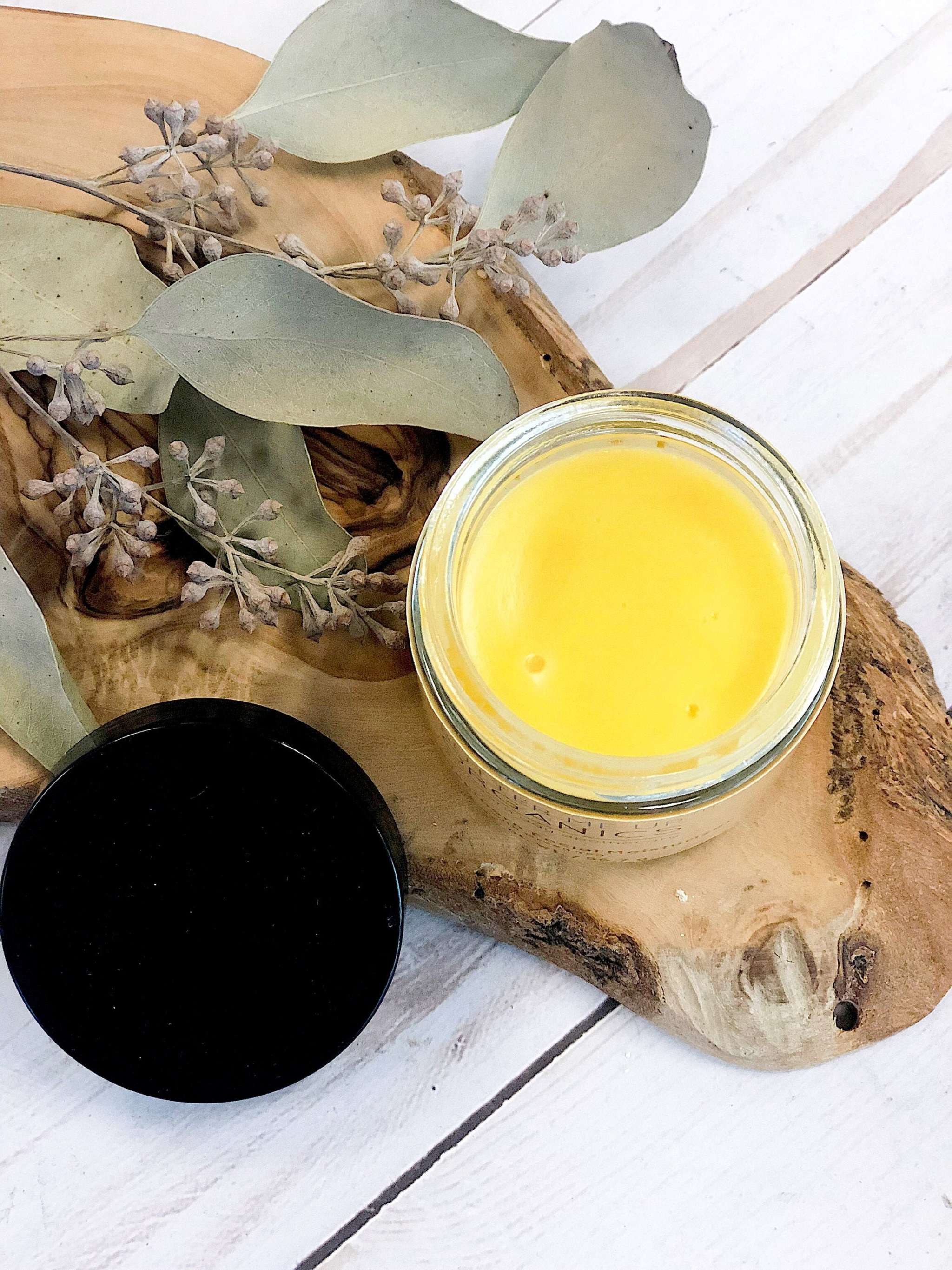 Organic Sea Buckthorn Facial Moisturizer in 2 oz glass jar with metal lid