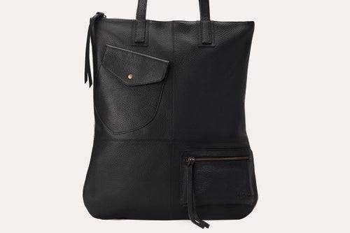 Fold n Hold Tote in cowhide leather with large interior and two exterior pockets, soft plaid lining, and zipper tassels.