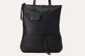Fold n Hold Tote in cowhide leather with large interior and two exterior pockets, soft plaid lining, and zipper tassels.