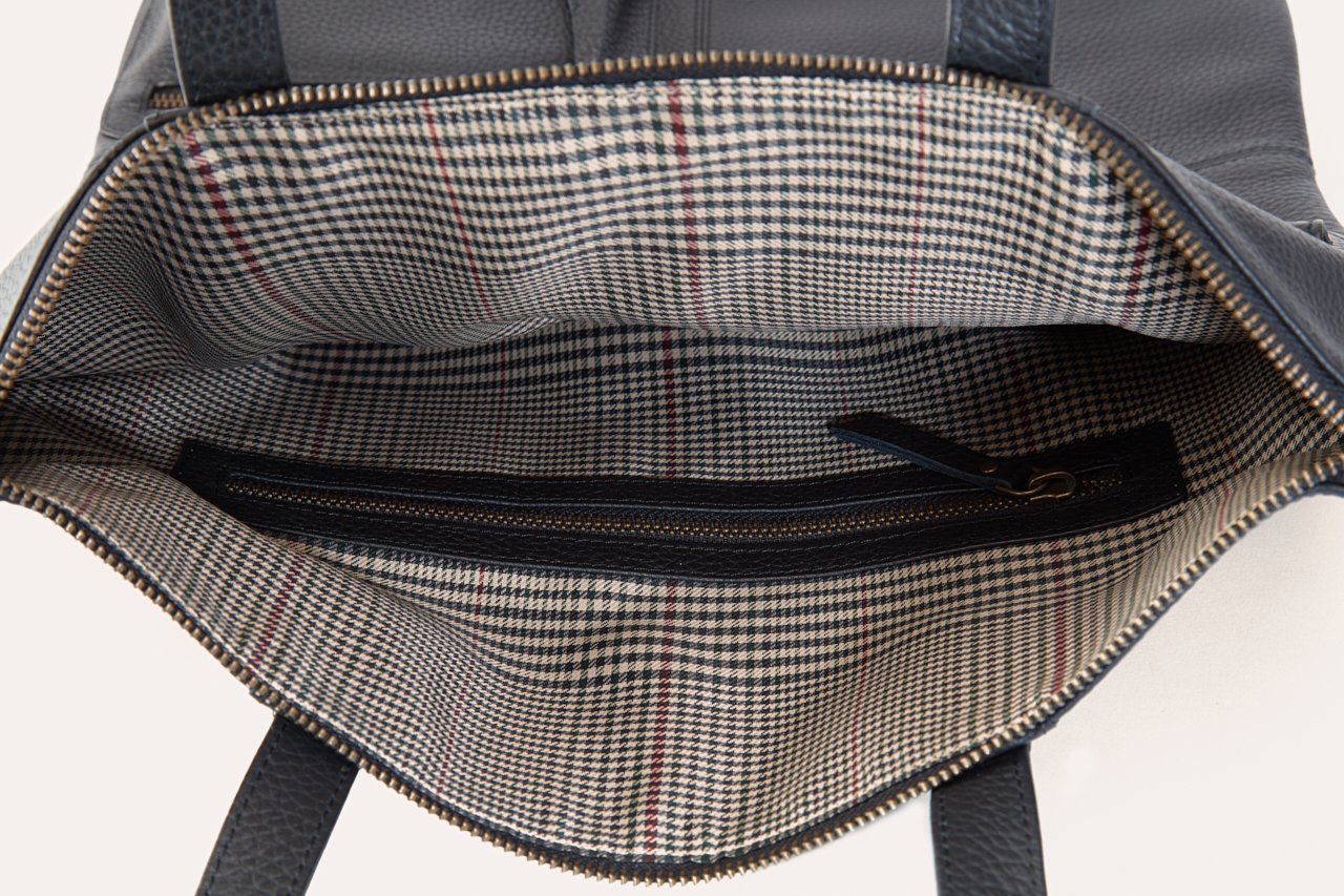 Kiko Fold n Hold Tote in cowhide leather with exterior pockets and plaid lining