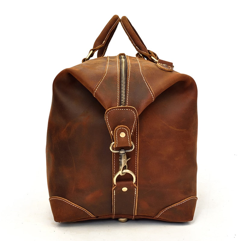 Vintage leather duffle bag made from premium crazy horse leather with spacious compartments and adjustable shoulder strap for travel and daily use