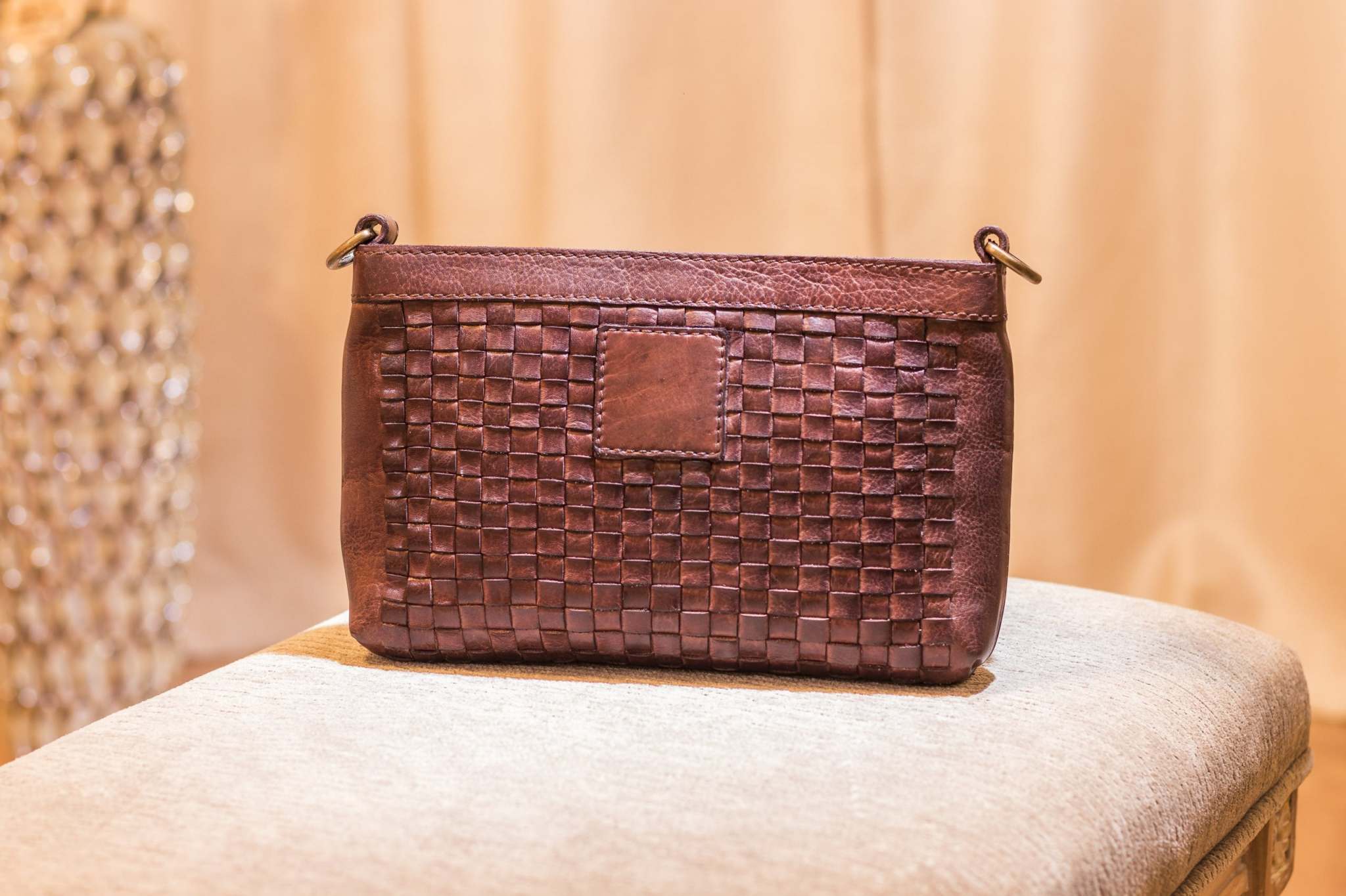 Kiko weaved crossbody bag in genuine washed leather with adjustable strap and top zip closure