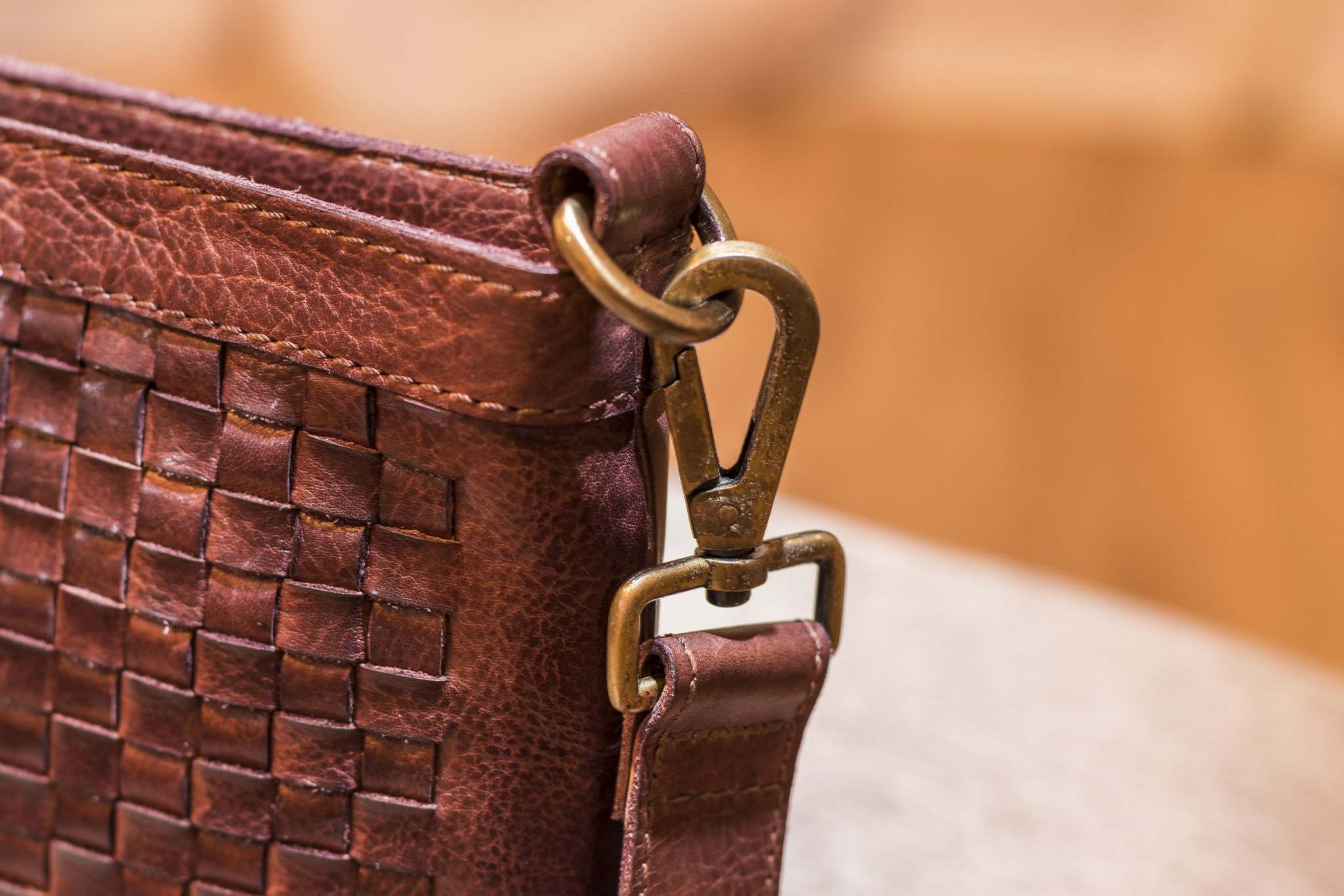 Kiko Weaved Crossbody Bag in genuine washed leather with adjustable strap and zip closure