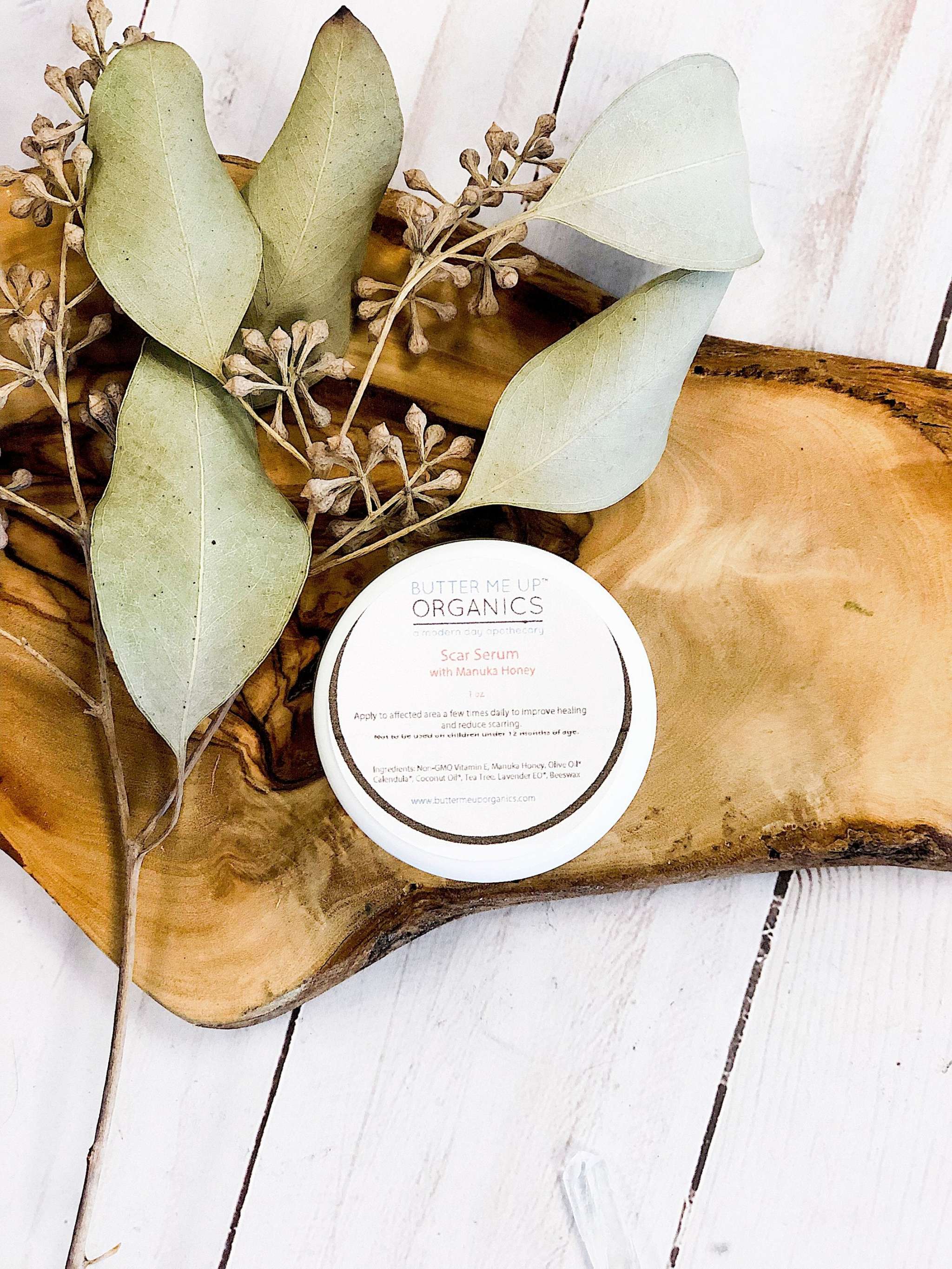 Bottle of organic scar healing serum with natural ingredients by Butter Me Up