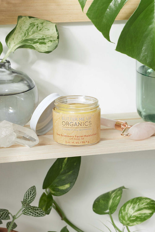 Organic sea buckthorn facial moisturizer in 2 oz glass jar with metal lid