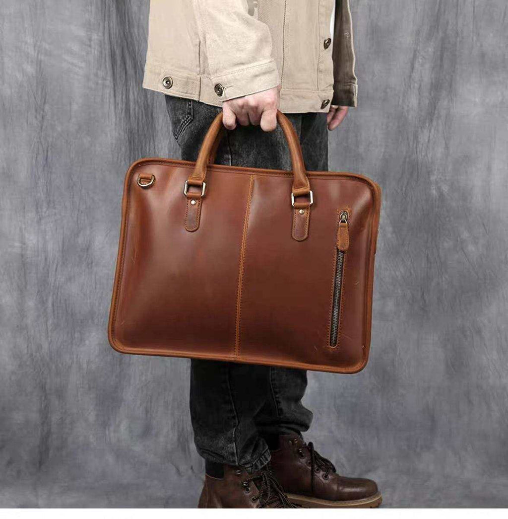 Hemming Leather Laptop Bag in brown leather, featuring twin top handles and a front vertical zip pocket
