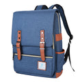 Slim Backpack in blue woven fabric with a flap closure, brown faux-leather straps and trim, and front zip pocket.