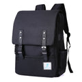 Vintage Laptop Backpack in black Oxford fabric, with a slim flap design, twin buckle straps, front zip pocket and side pockets.