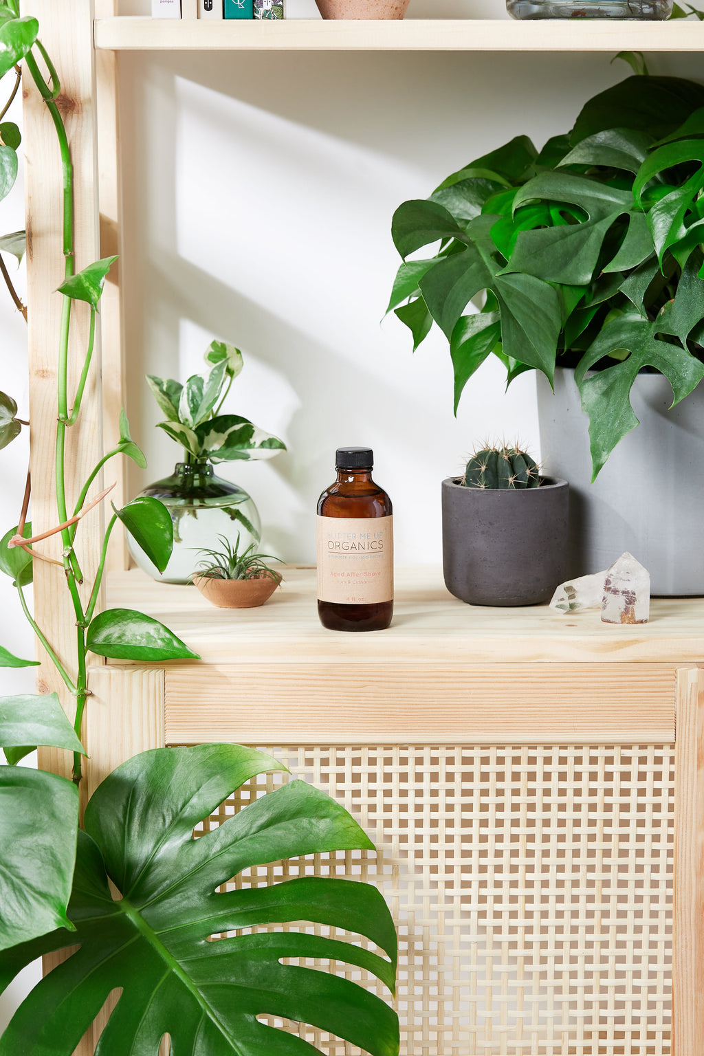Bottle of Natural Aged After Shave by Butter Me Up Organics with woodsy and citrus scent ingredients