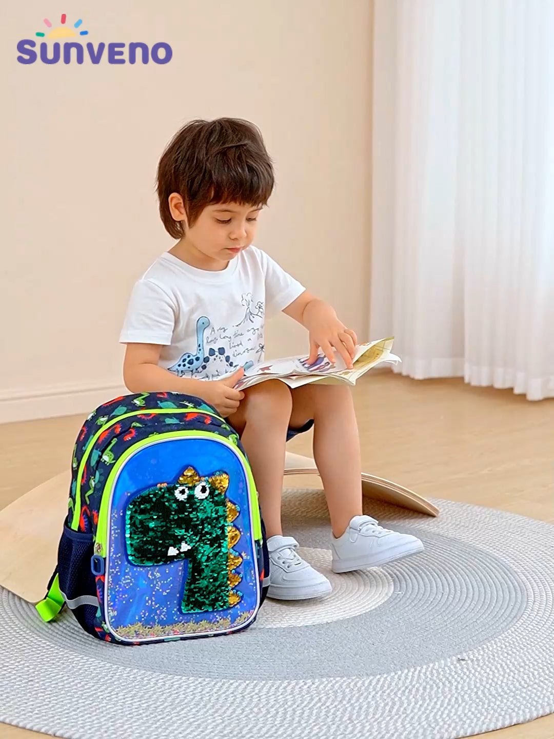 Suveno - Dinosaur Children's Backpack in blue with colorful reversible sequins and dinosaur design
