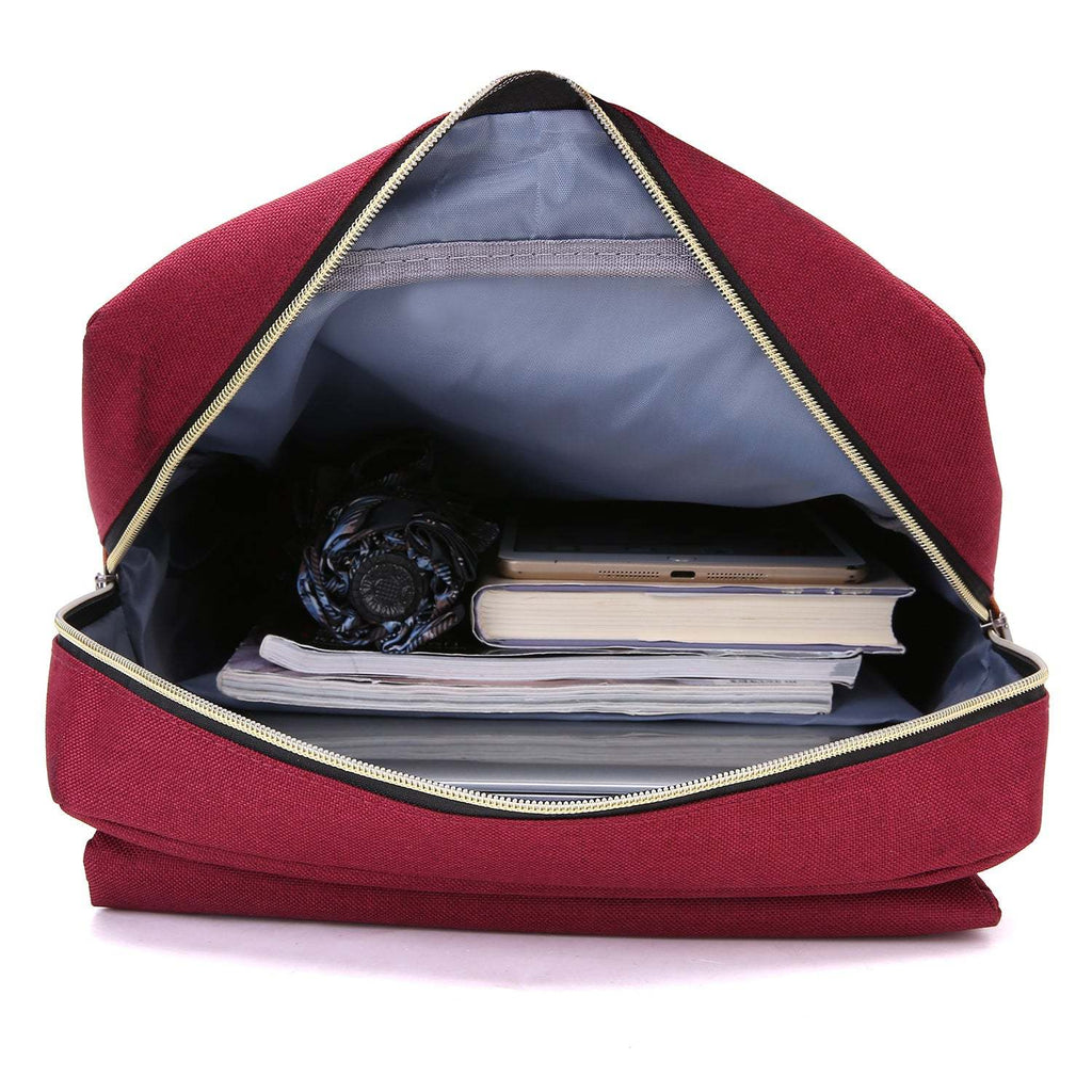 Vintage Laptop Backpack in burgundy woven fabric, shown open with grey lining, a zippered inner pocket, books, and a compact item inside.