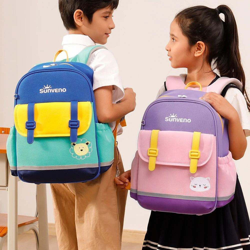 Adventure Cat Kid Backpacks in blue and purple, waterproof fabric with colorful front pockets and animal patches