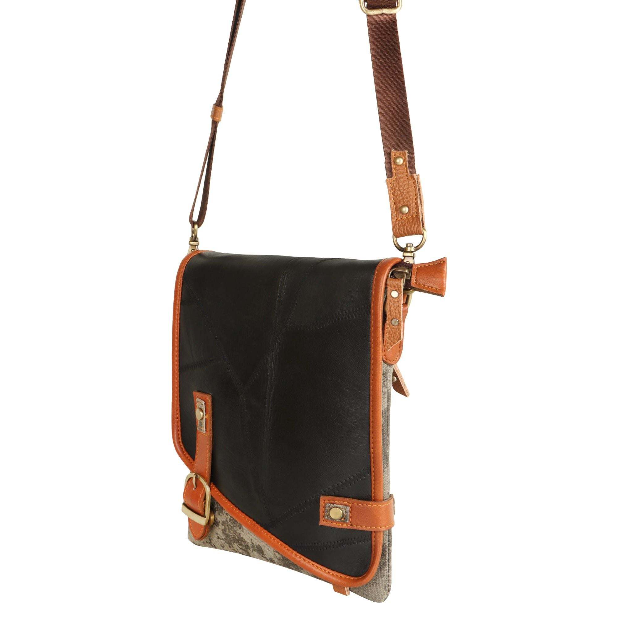 Vaan & Co Quest Crossbody Bag in Carbon Grey with asymmetrical flap and buckle closure made from upcycled leather and recycled canvas