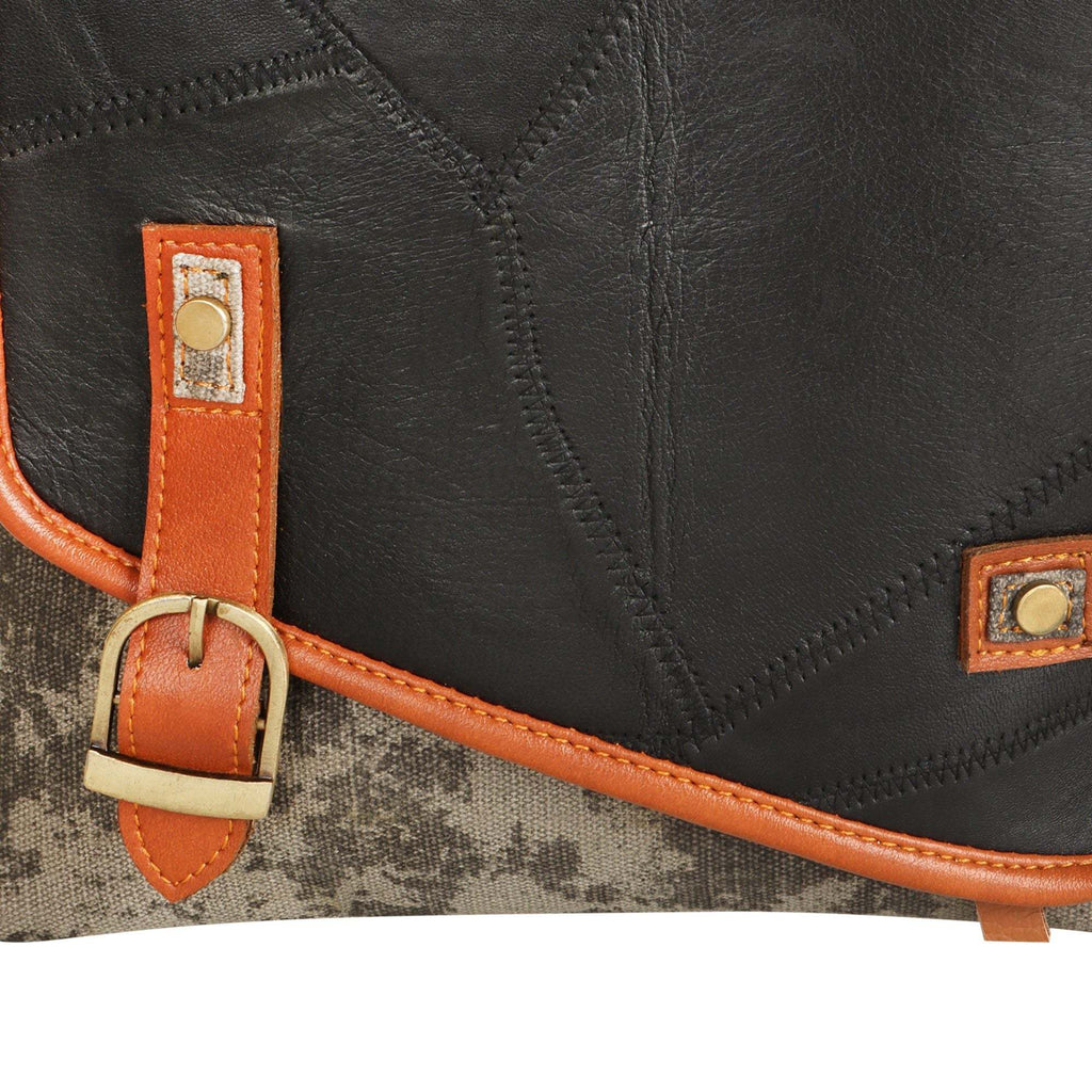 Vaan & Co Quest Crossbody Bag in carbon grey with asymmetrical flap and buckle closure made from upcycled leather and recycled canvas