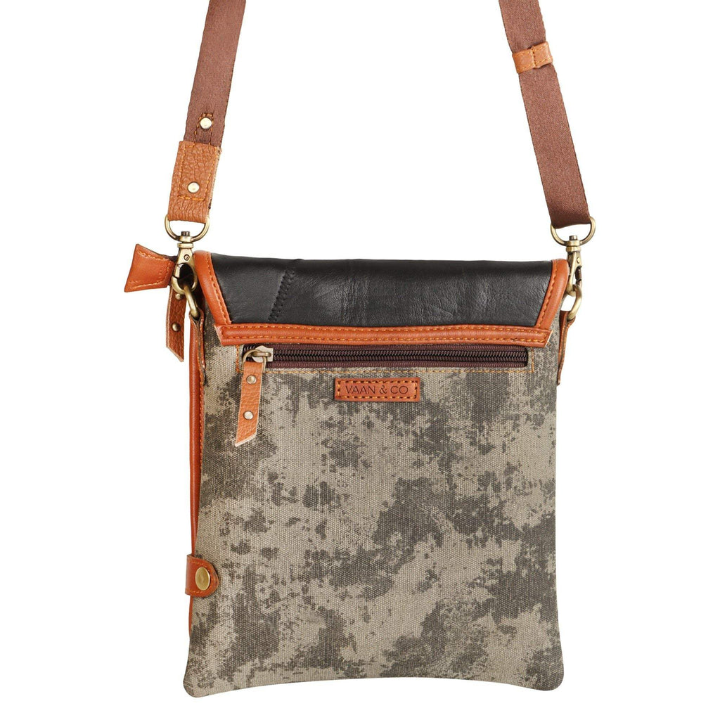 Vaan & Co Quest Crossbody Bag in carbon grey with asymmetrical flap and buckle closure made from upcycled leather and recycled canvas