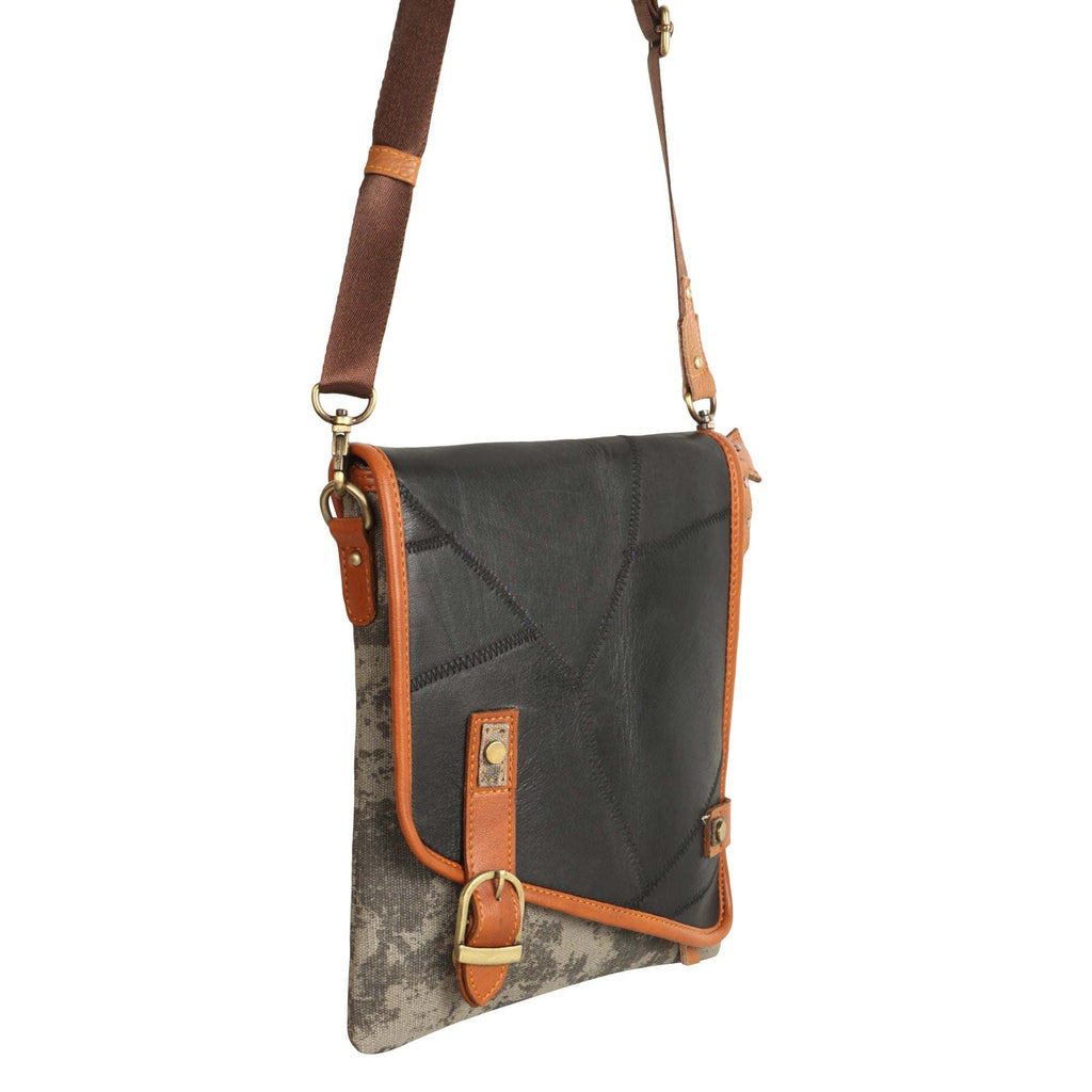 Vaan & Co Quest Crossbody Bag in carbon grey with asymmetrical flap and buckle closure made from upcycled leather and recycled canvas