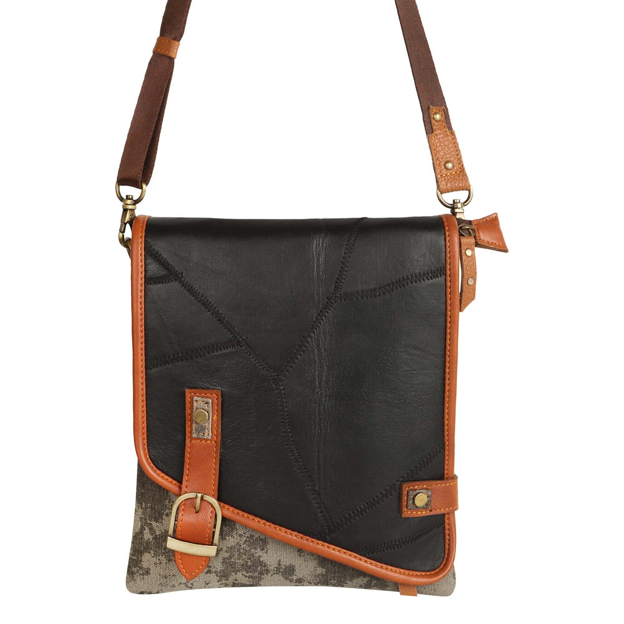 Vaan & Co Quest Crossbody Bag in carbon grey with asymmetrical flap and buckle closure made from upcycled leather and recycled canvas