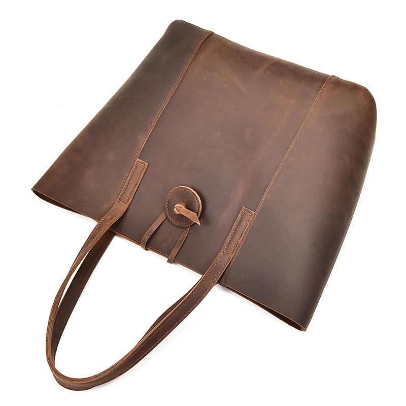 The Taavi handcrafted leather tote bag in durable crazy horse leather with ergonomic straps and removable clutch