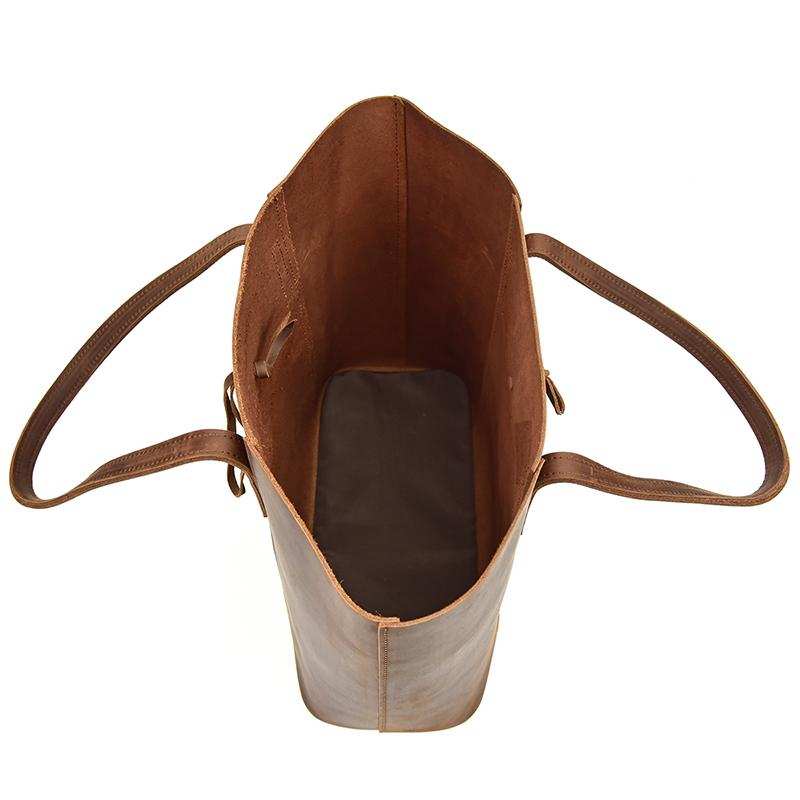 Handcrafted leather tote bag made of durable crazy horse leather with spacious interior and removable clutch