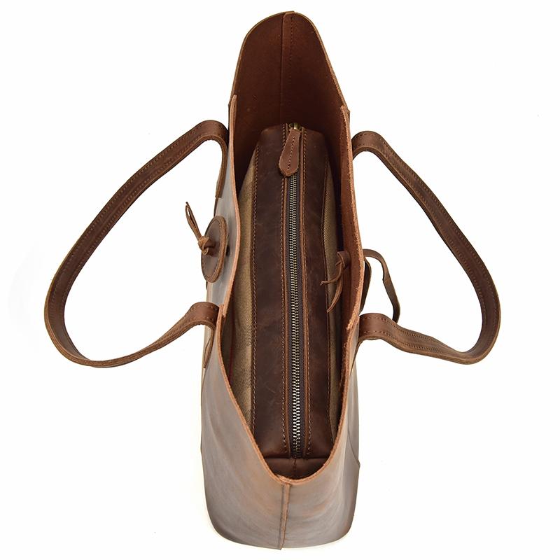Handcrafted leather tote bag made from durable crazy horse leather with ergonomic straps and removable clutch
