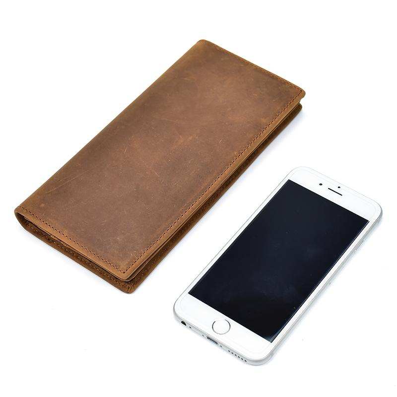 The Pathfinder Bifold Wallet made of genuine Crazy Horse leather with multiple card slots, ID window, zippered coin pocket, and slim design