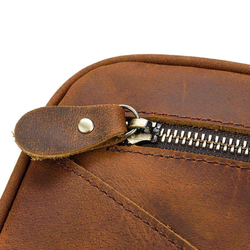 Genuine leather travel toiletry bag in brown crazy horse leather with multiple compartments for organized travel essentials