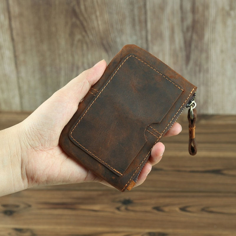Handmade Cael leather coin purse in rustic full-grain crazy horse leather with YKK zipper and hand-stitched detailing