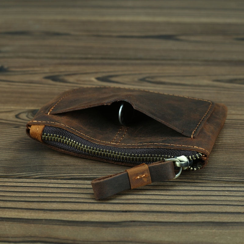 Handmade Cael leather coin purse with YKK zipper and key ring on rustic full-grain crazy horse leather
