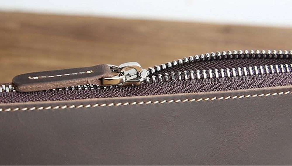 Handmade leather makeup bag in premium full-grain crazy horse leather with YKK zipper and sleek design