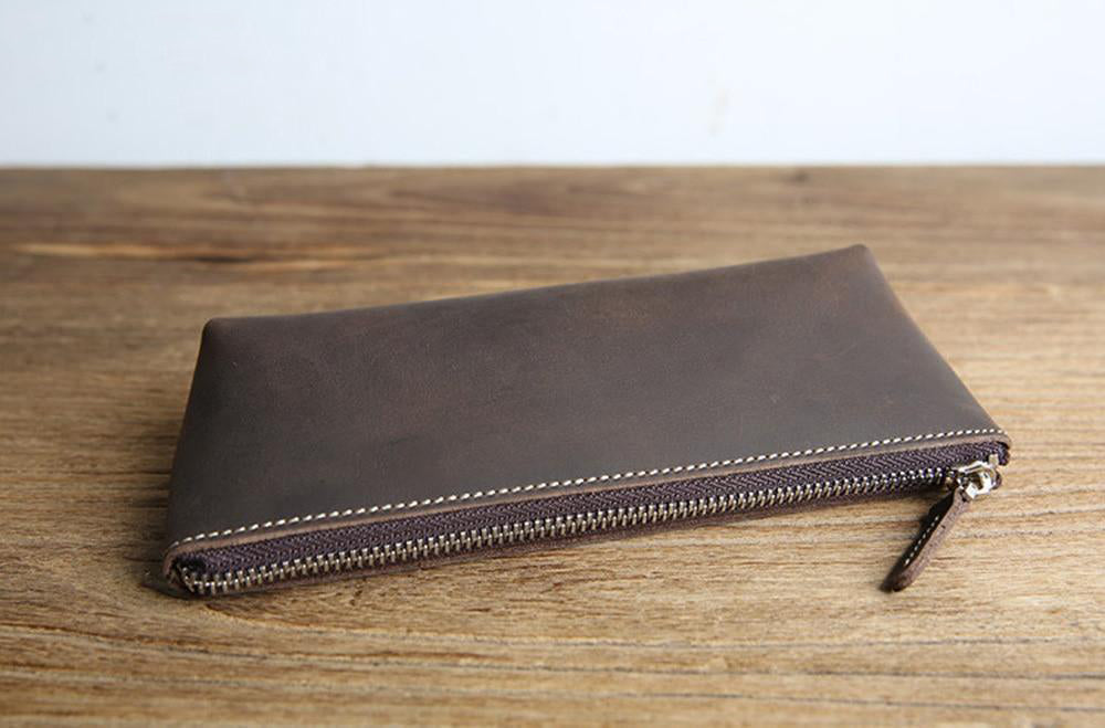 Handmade leather makeup bag in premium full-grain crazy horse leather with YKK zipper and sleek design