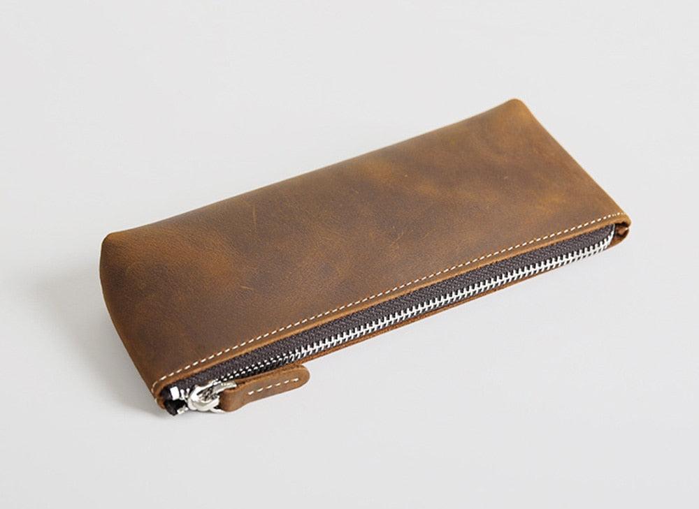 Handmade leather makeup bag in premium full-grain crazy horse leather with YKK zipper and sleek design