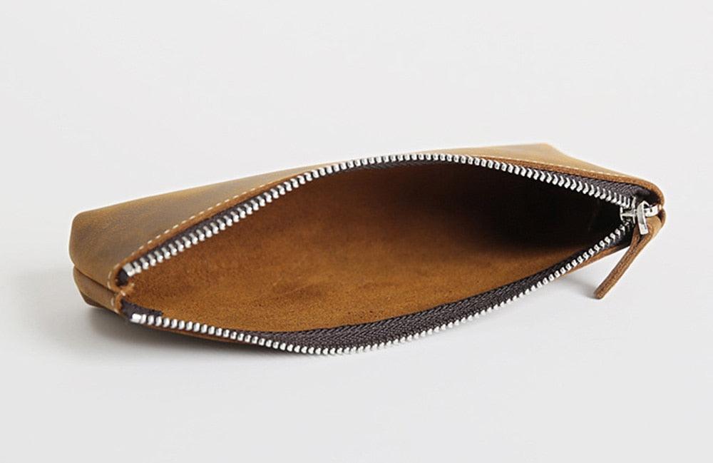 Handmade leather makeup bag in full-grain crazy horse leather with YKK zipper and sleek design
