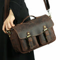 The Faust Leather Crossbody Messenger Bag in full-grain crazy horse leather shown with adjustable strap and clasp pockets