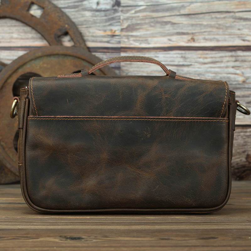 The Faust Leather Crossbody Messenger Bag in full-grain crazy horse leather with adjustable shoulder strap and compartments for camera gear and everyday essentials