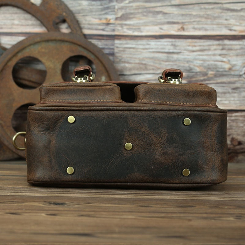 The Faust Leather Crossbody Messenger Bag in full-grain crazy horse leather with adjustable shoulder strap and camera compartments