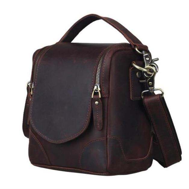 Handcrafted small leather camera bag Calista made from full-grain vegetable-tanned leather with adjustable strap and zippered compartments