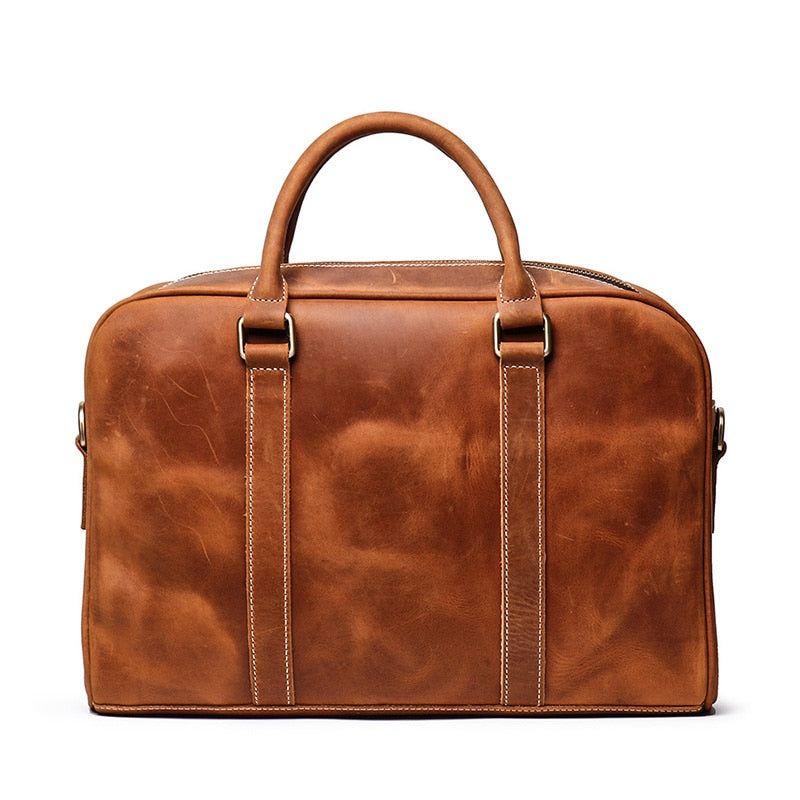 Vintage leather briefcase made from premium crazy horse leather with adjustable shoulder strap and multiple compartments for laptop and essentials