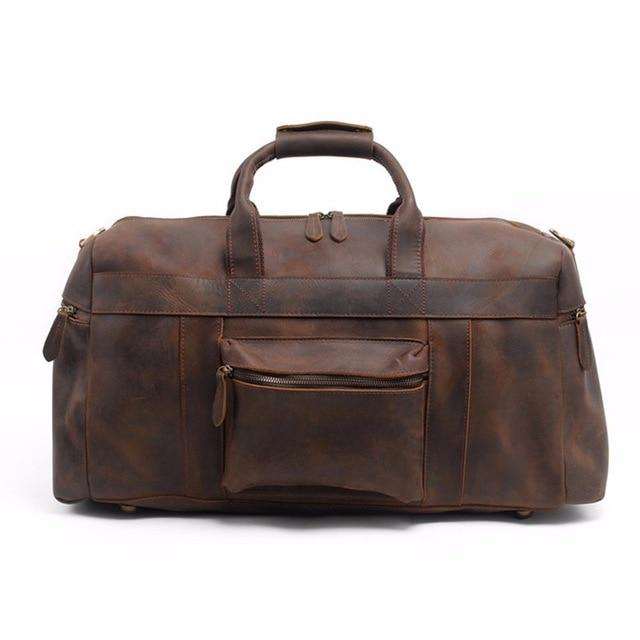Handcrafted leather duffle bag in vintage style with adjustable strap and multiple pockets