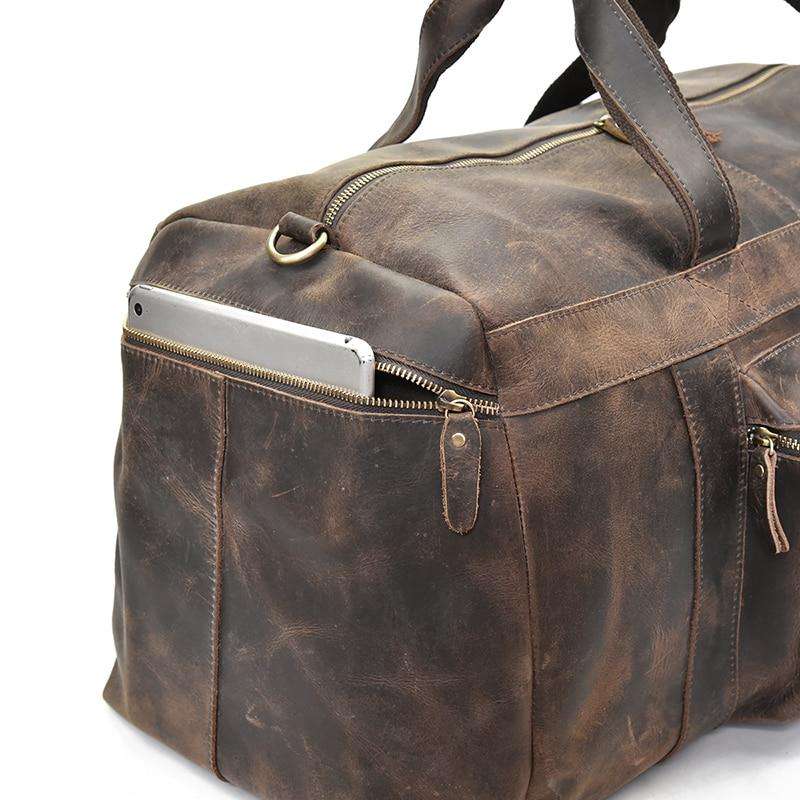 The Colden Leather Duffle Bag in premium crazy horse leather with spacious compartments and soft leather handles for stylish travel