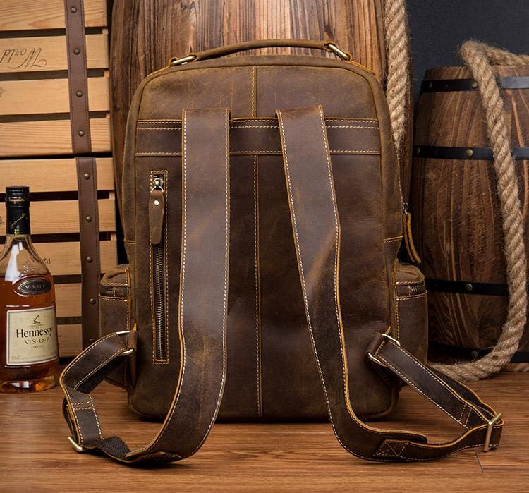 The Langley Genuine Leather Backpack vintage style in deep rusted chocolate brown with multiple compartments and adjustable straps