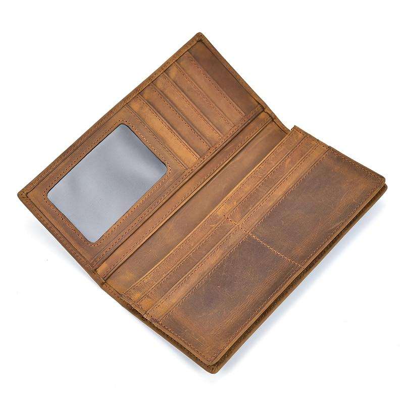 Sleek genuine leather bifold wallet with multiple card slots, clear ID window, zippered coin pocket, and slim design