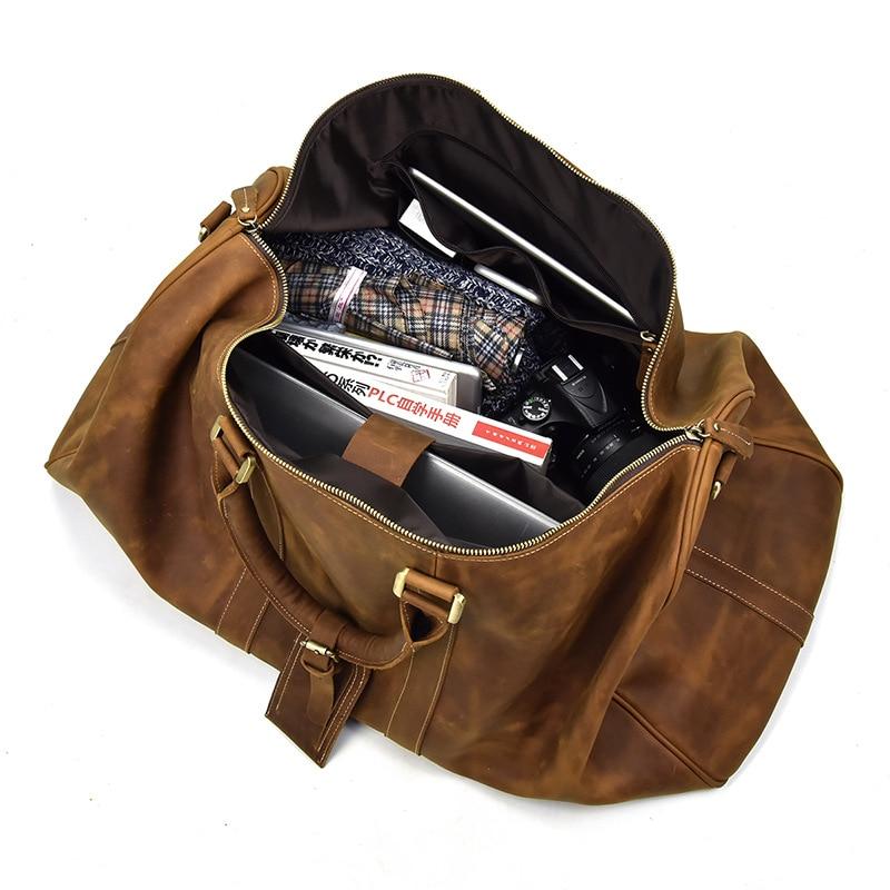 Bjarke Weekender handcrafted leather duffle bag in vintage crazy horse leather with removable shoulder strap and multiple compartments
