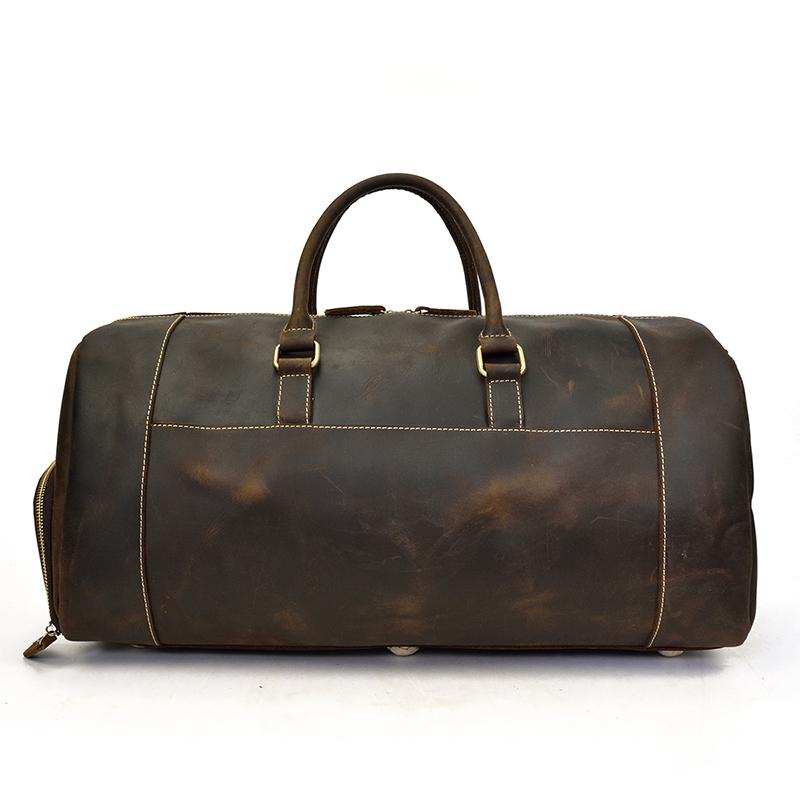Handmade leather duffle bag in rich crazy horse leather with spacious compartments and soft handles for comfortable travel