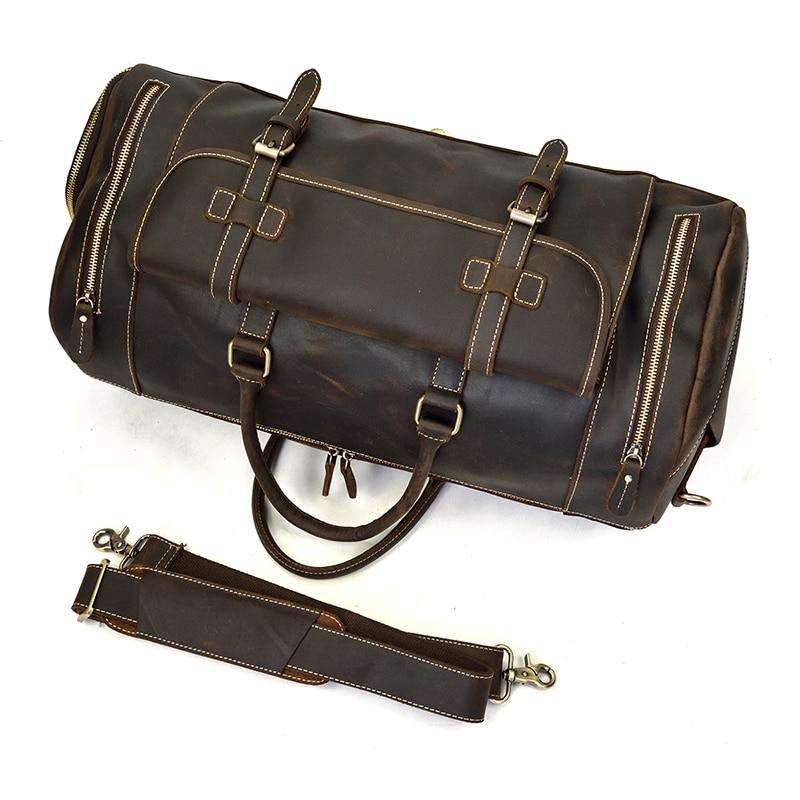 Handmade leather duffle bag in rich brown with sturdy handles and removable shoulder strap for stylish travel