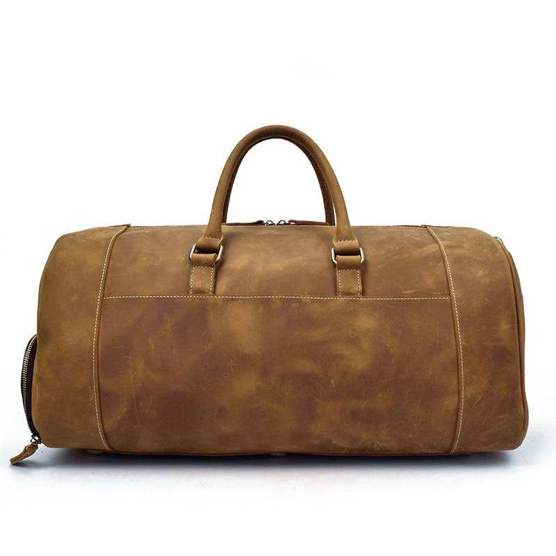 Handmade leather duffle bag made from premium crazy horse leather with spacious compartments and comfortable handles for travel
