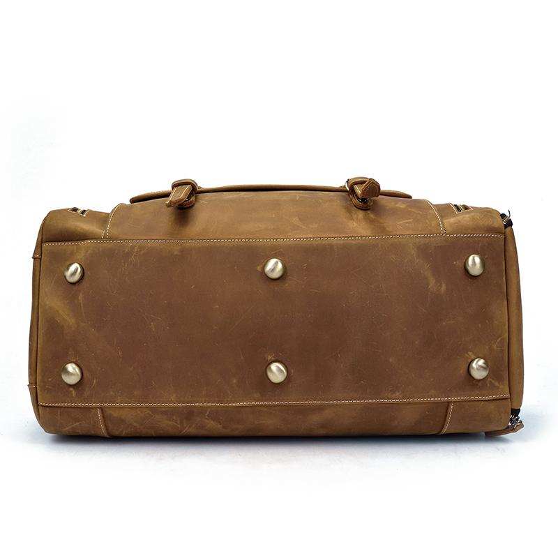 Handmade leather duffle bag in rich brown with spacious compartments and sturdy handles for stylish travel