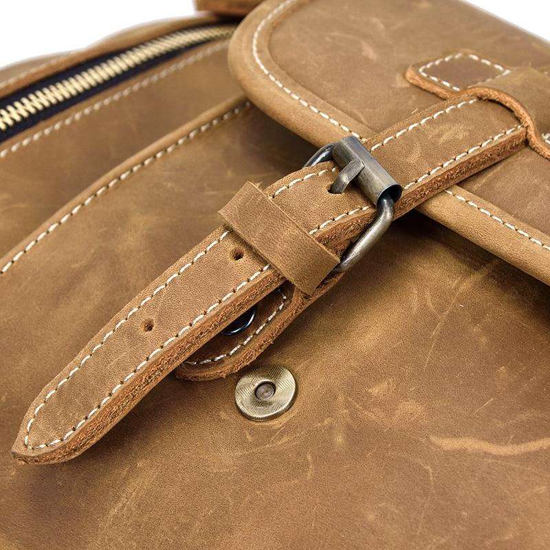 Handmade leather duffle bag in rich brown crazy horse leather with thick handles and adjustable shoulder strap for stylish travel