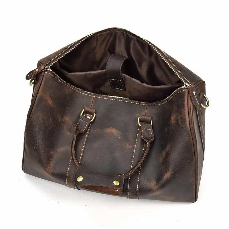 The Brandt Weekender small black leather duffle bag with adjustable strap and sturdy handle
