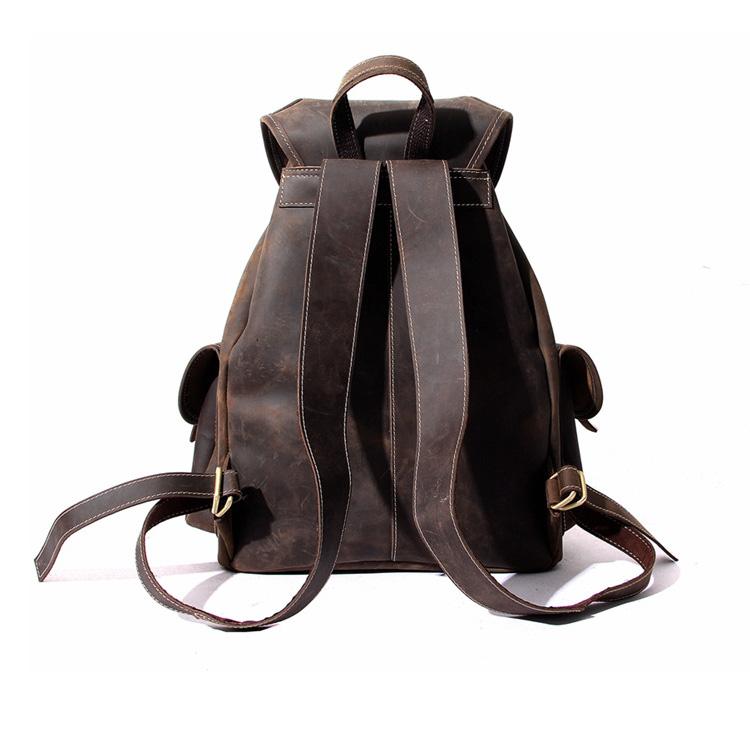 The Asmund Backpack genuine leather rucksack in distressed brown crazy horse leather with buckled pockets and adjustable straps