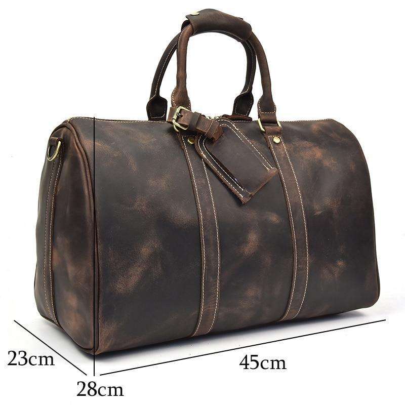 The Brandt Weekender small black leather duffle bag with handles and shoulder strap